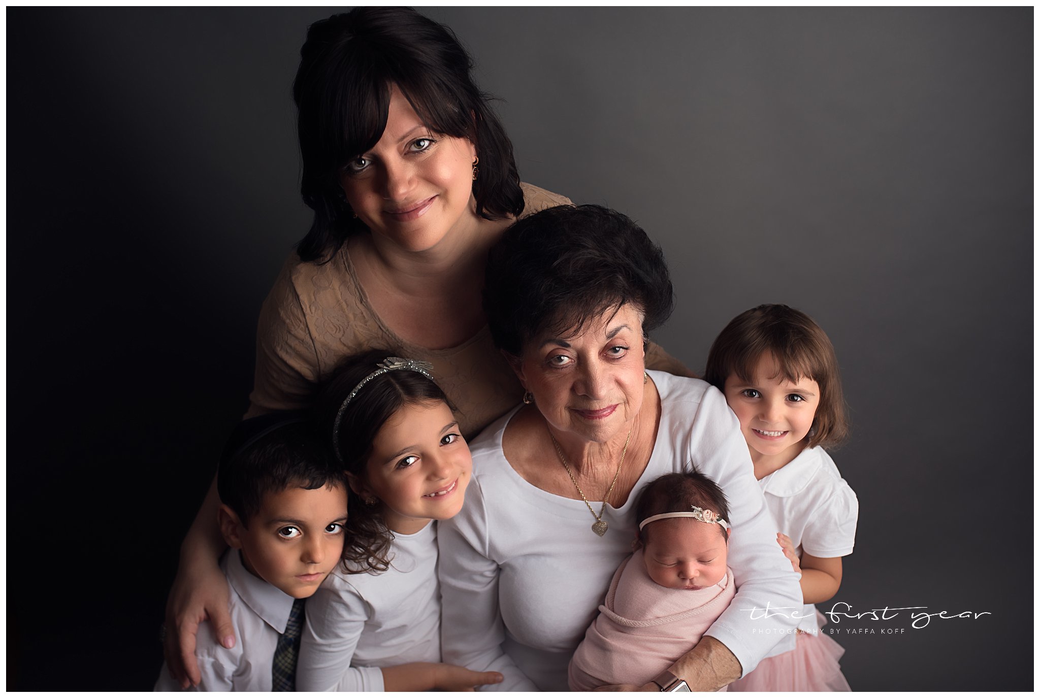 Family portrait of Baby Avital with parents and siblings during a newborn session in Chevy Chase, MD.