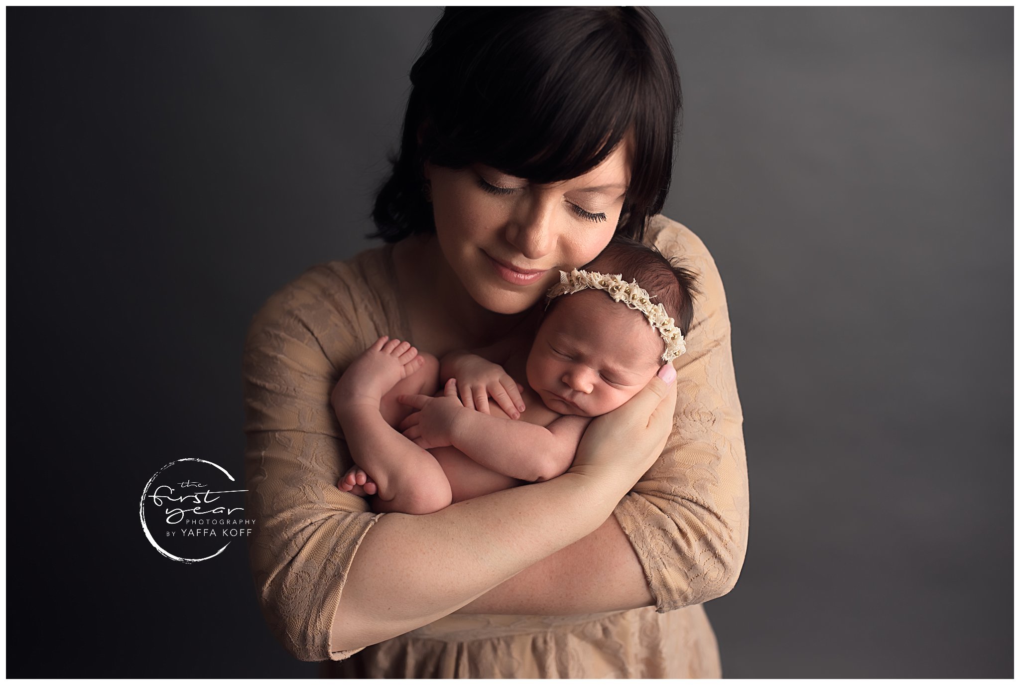 Newborn baby girl with mother, professional photography session in Chevy Chase, MD.