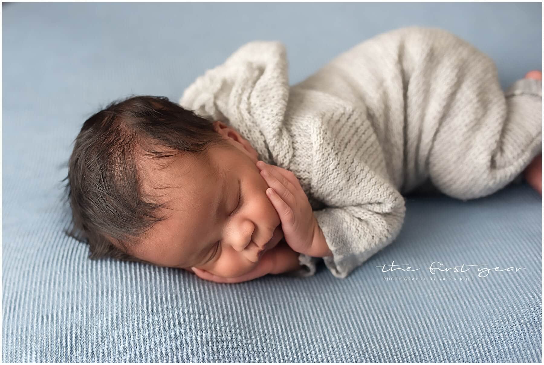 Newborn baby Maxwell peacefully sleeping during Maryland portrait session.