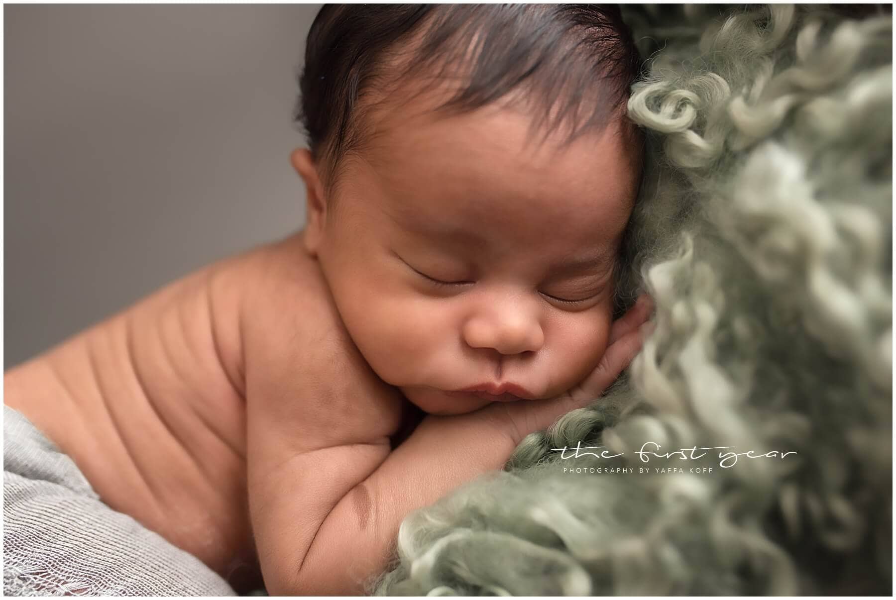 Newborn baby Maxwell peacefully sleeping during Maryland portrait session.