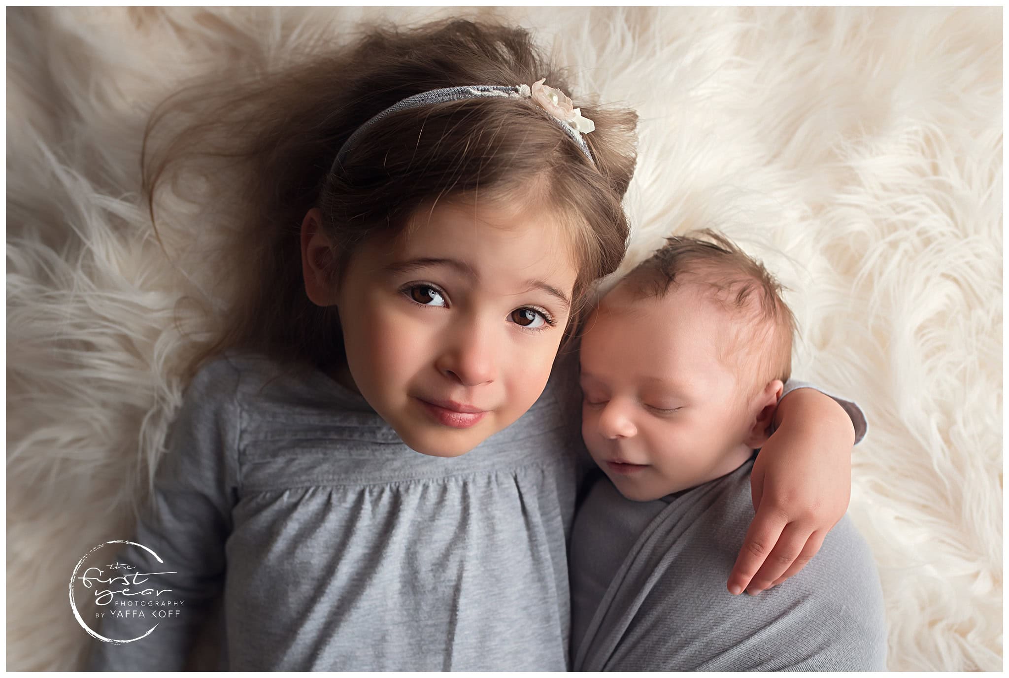Adorable sibling portrait of a young girl and newborn brother in Silver Spring, MD.