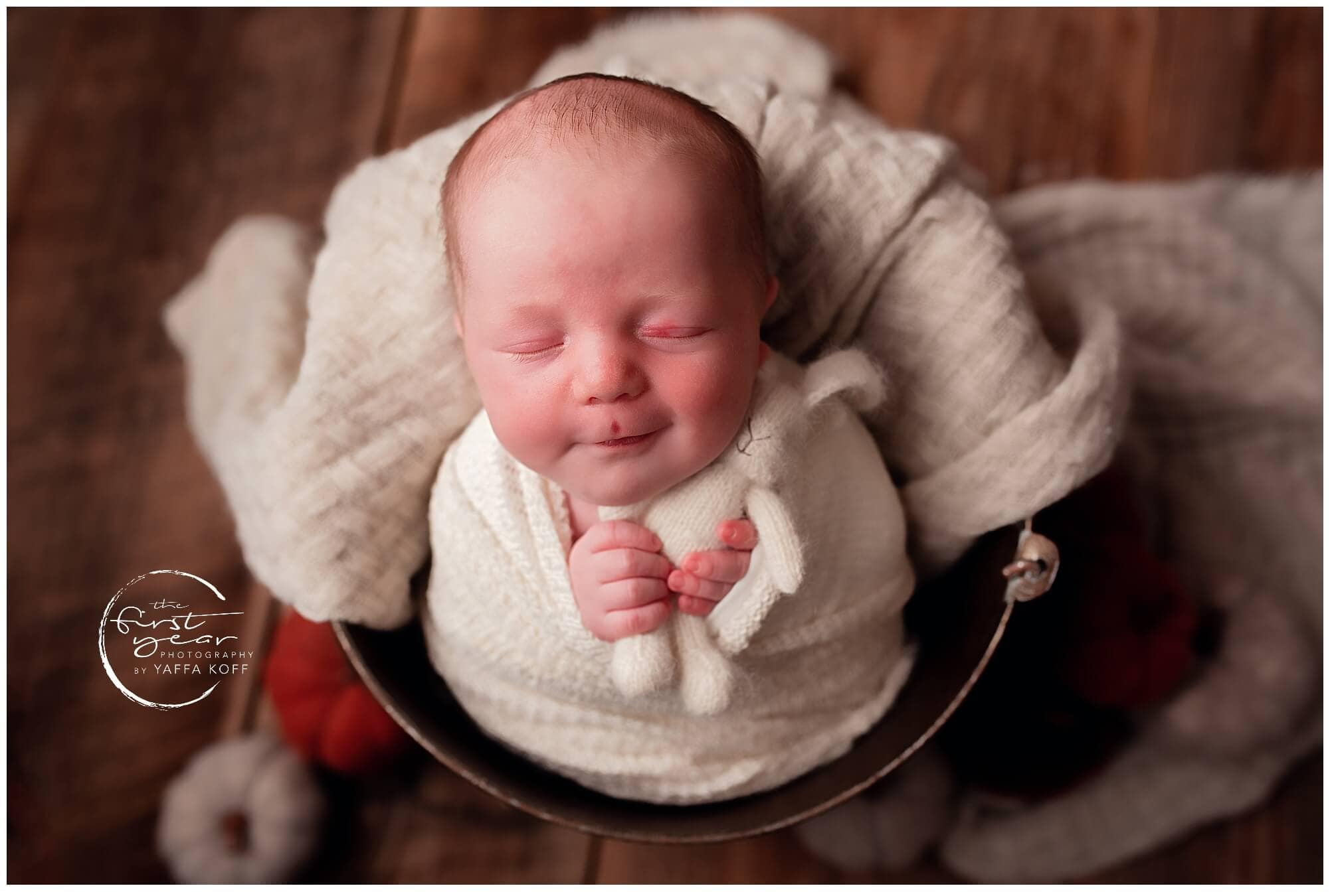 Baby Yehuda sleeping peacefully in a cozy blanket.