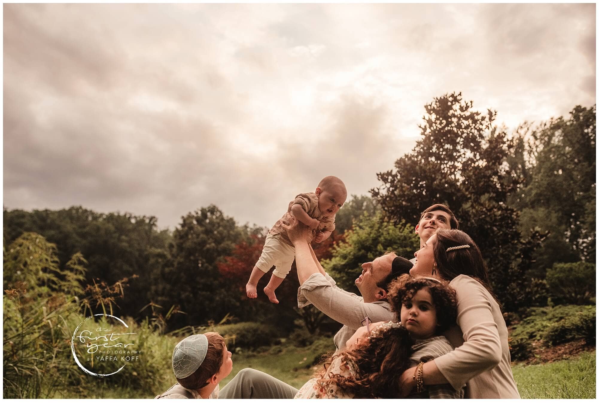 Outdoor family and baby photography session in Silver Spring, Maryland. Capturing joyful moments wit.