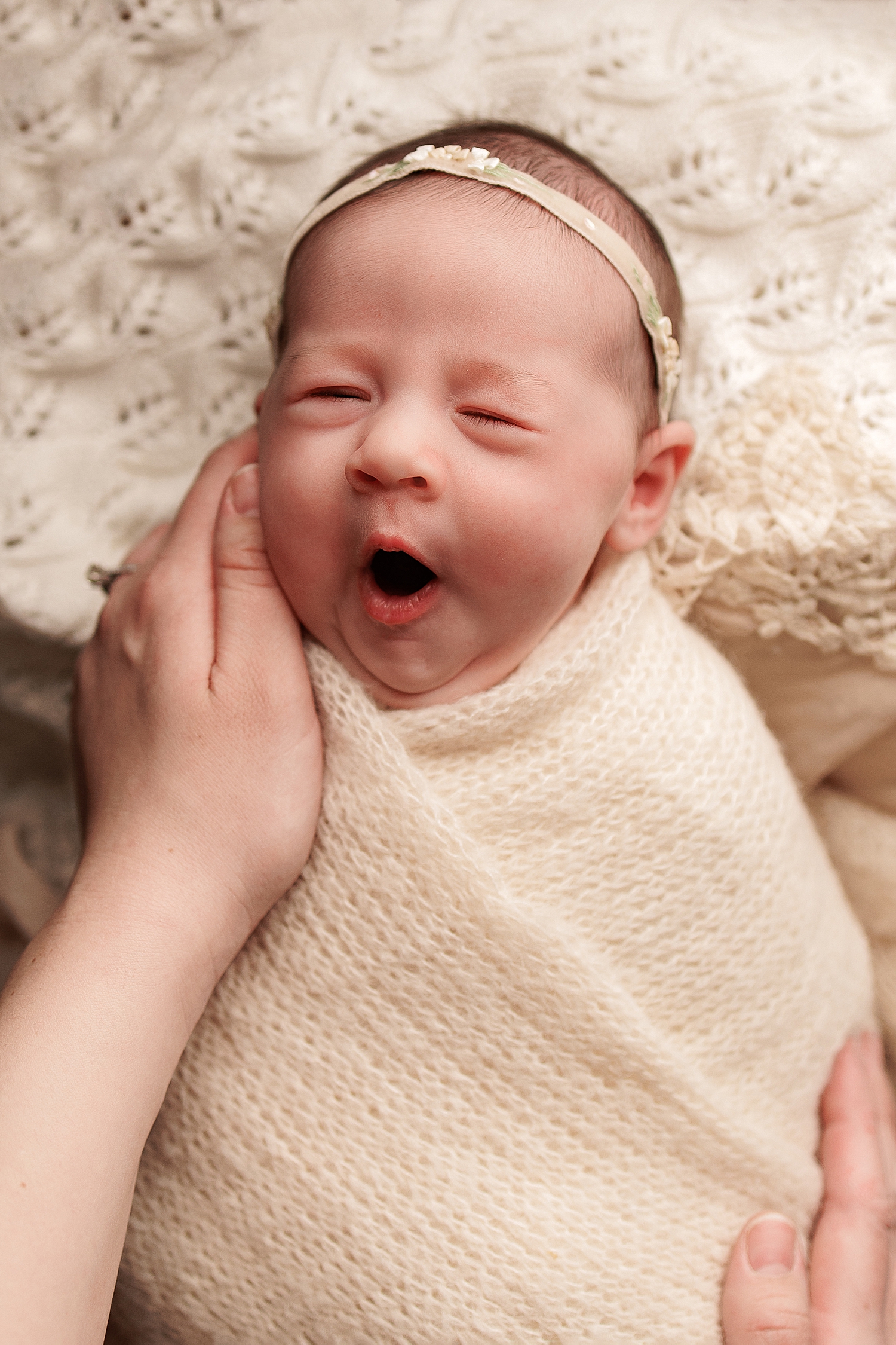 little one with headband yawns by Silver Spring Family Photographer