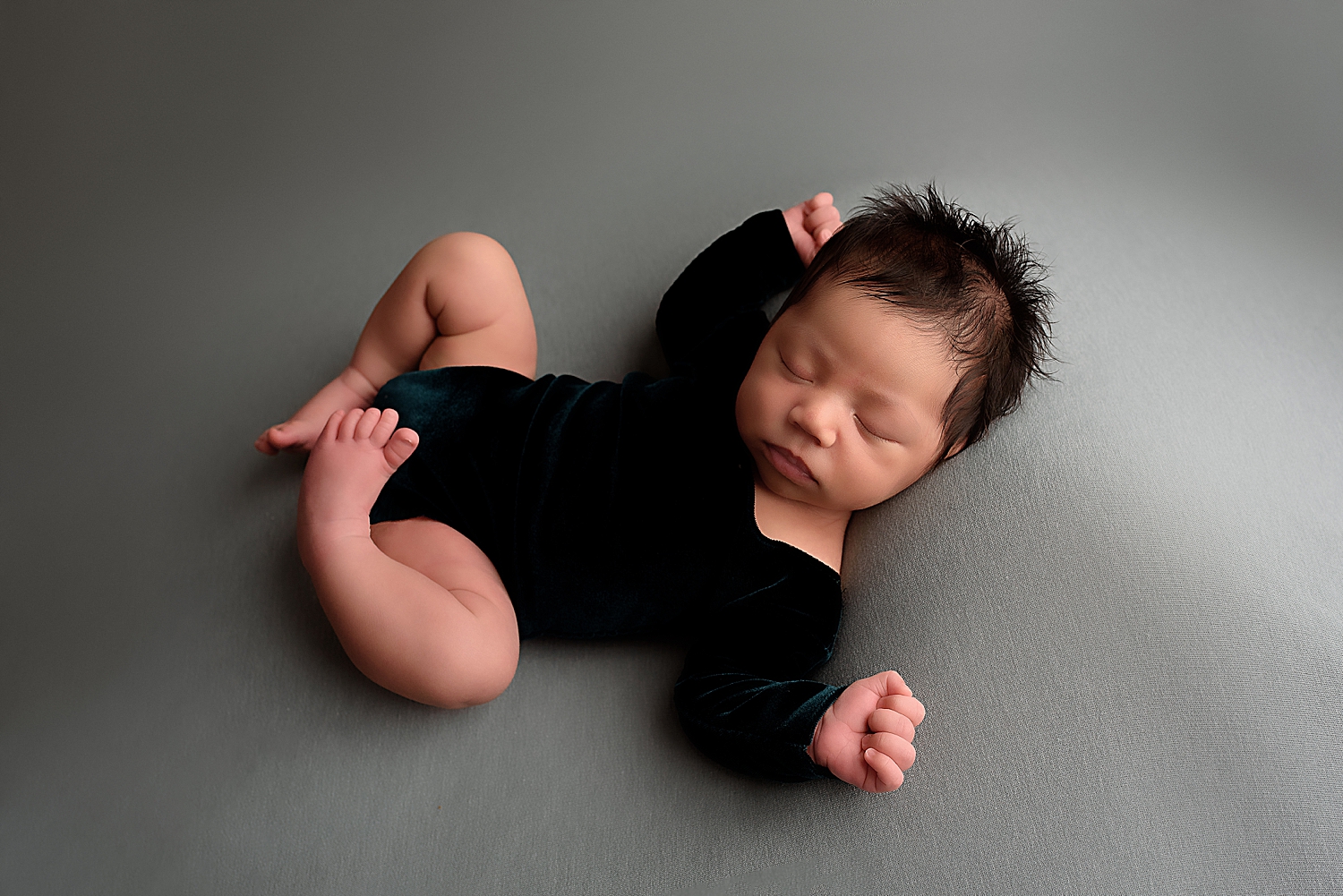 baby in velvet onesie by Washington dc photographer