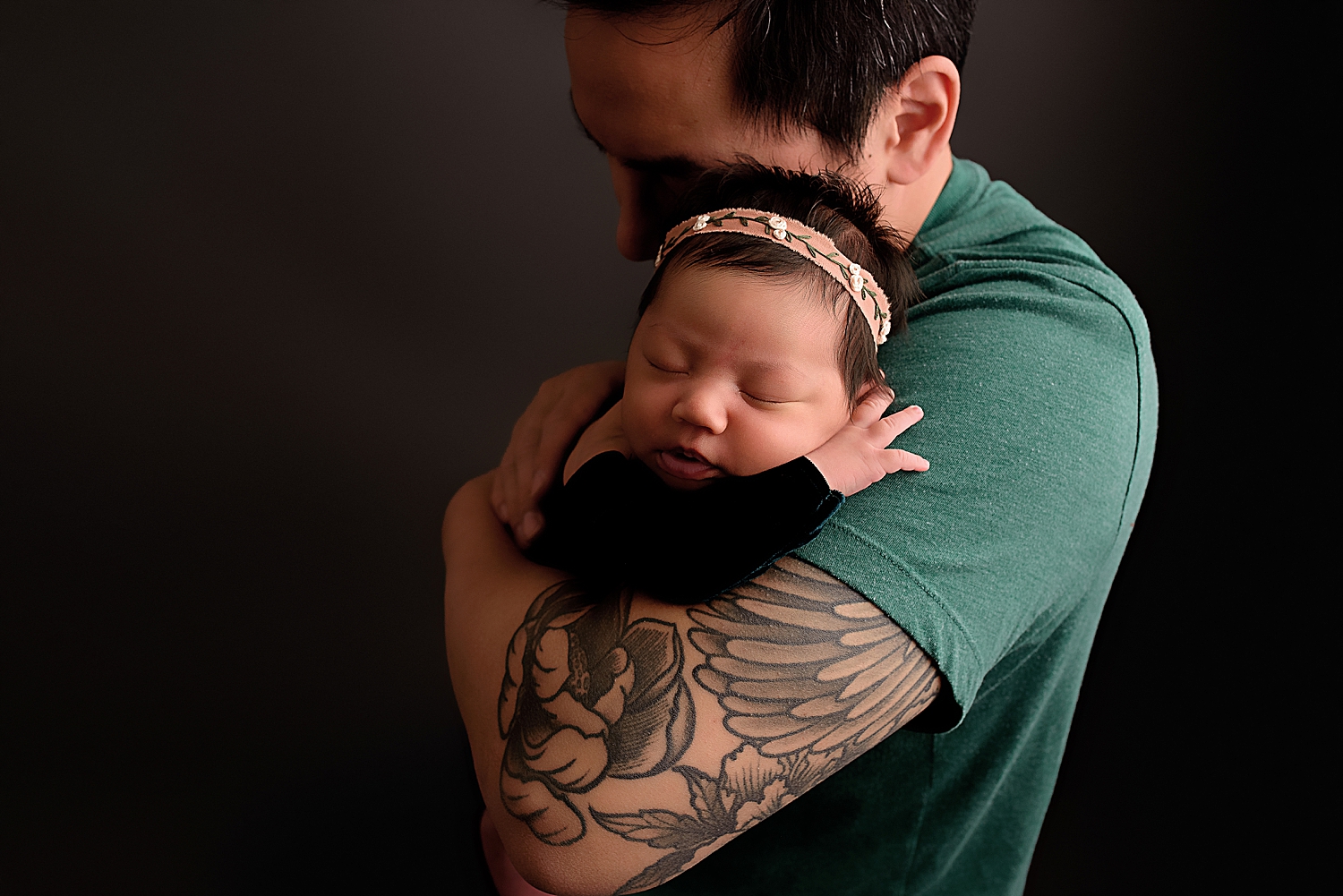 little girl with headband asleep on dad's shoulder by Washington DC photographer