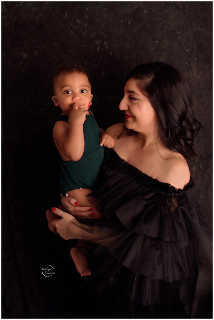 Baby and mother portrait during cake smash session in Silver Spring, MD.