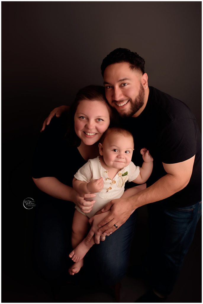 Happy family celebrating a child's first birthday with a professional photo in Silver Spring, MD.