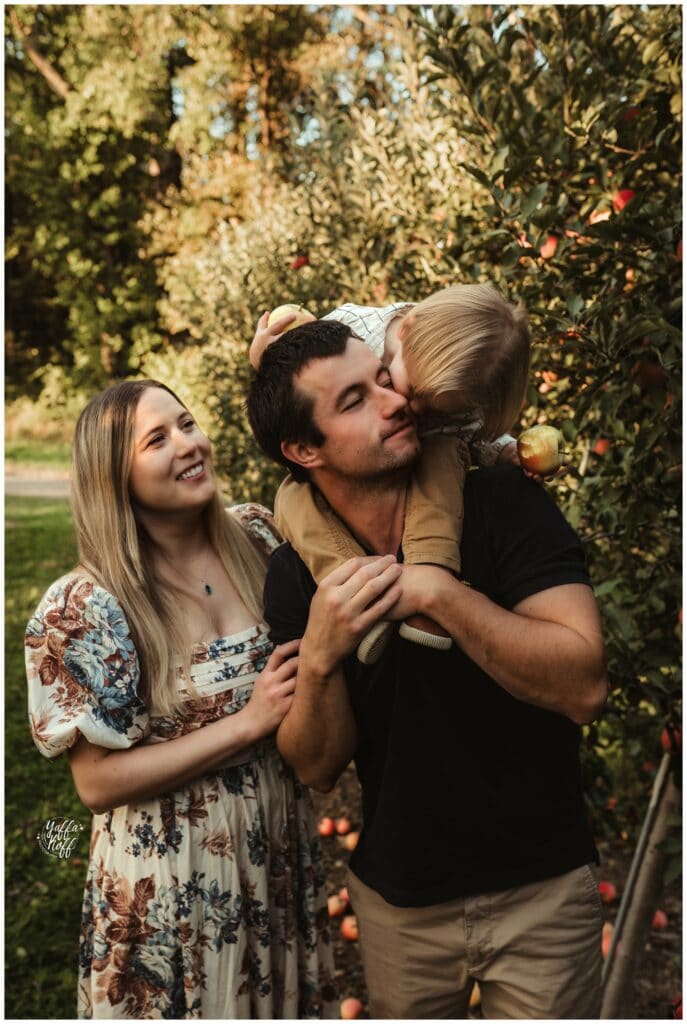 A joyful family enjoying a sunny outdoor photo session in Silver Spring, Maryland, capturing love an.