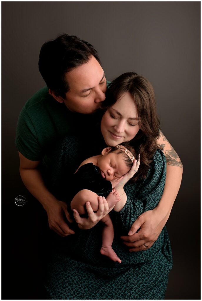 Newborn with parents in a studio, Silver Spring, MD.